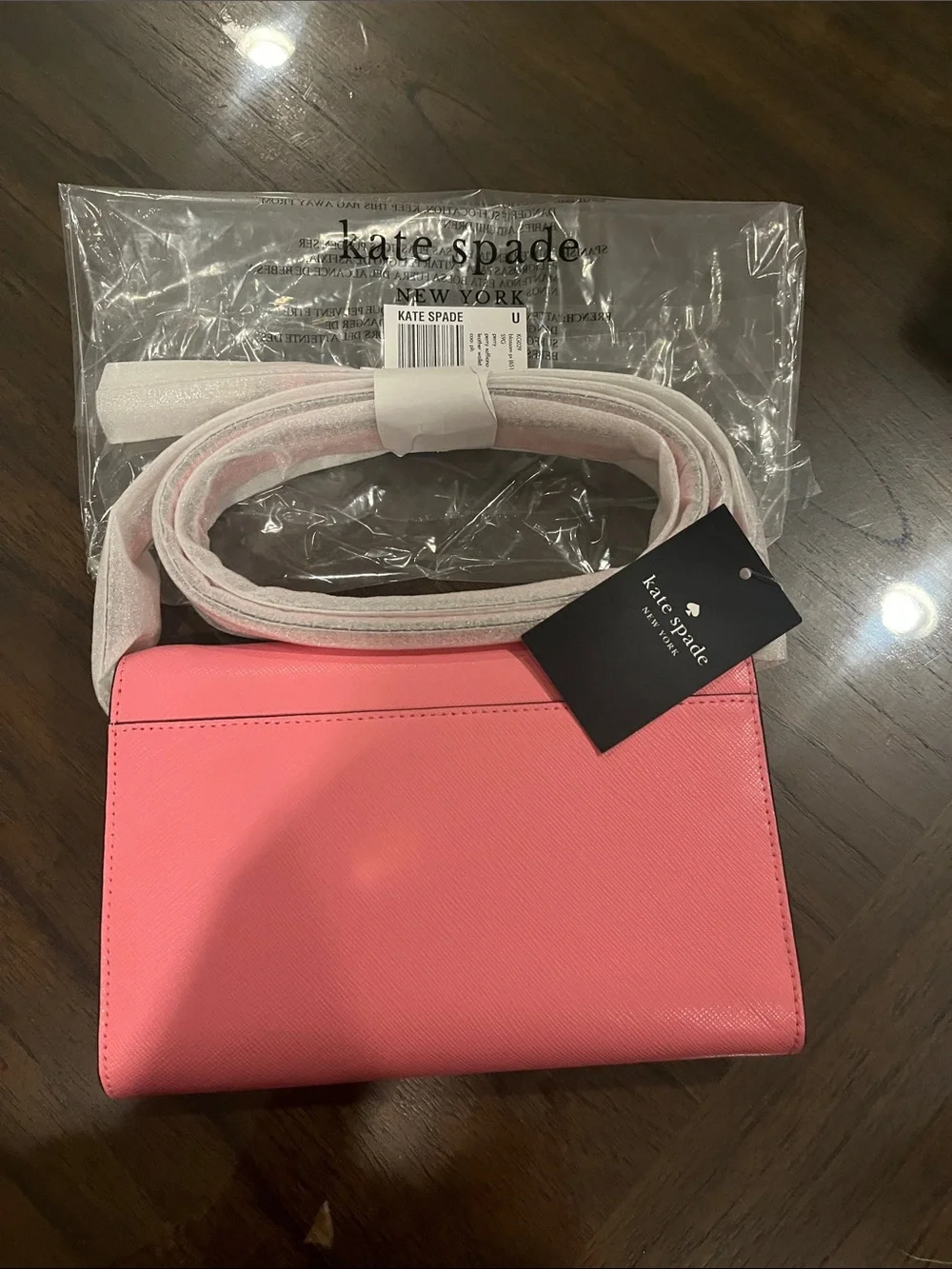kate spade pink crossbody bag with gold logo